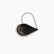 Black handbag with a chain strap on a white background