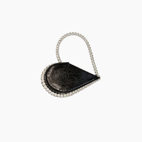 Black handbag with a chain strap on a white background