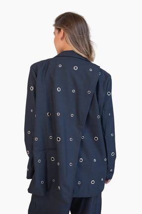 Navy blue jacket with circular cutouts 
