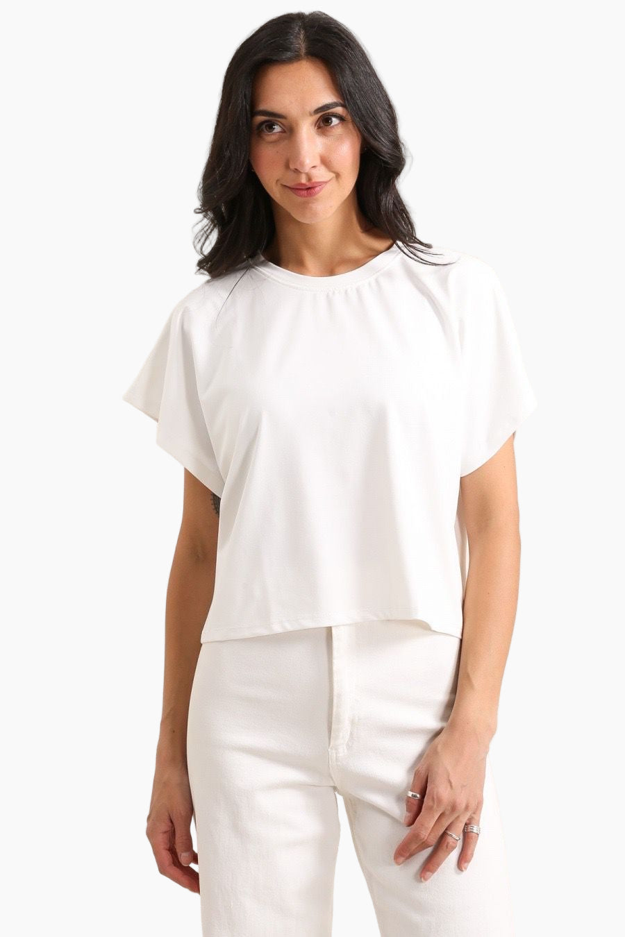 Woman wearing a white blouse and pants 