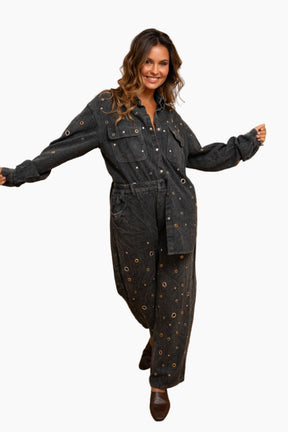 Woman wearing a black denim jumpsuit 