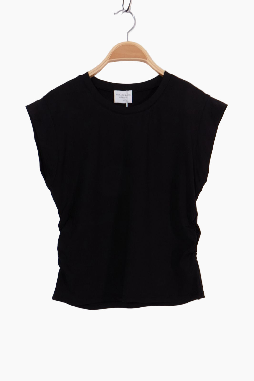 Black sleeveless top on a wooden hanger 