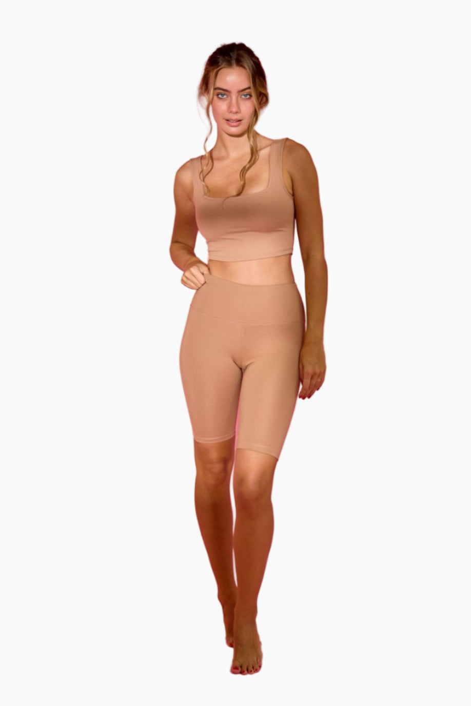 Woman wearing a beige shapewear outfit 