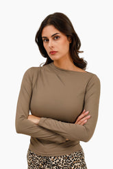 Woman wearing a brown long-sleeve top 
