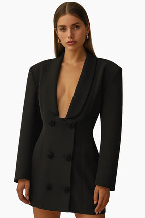 Black blazer dress worn by a model 