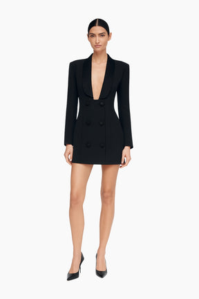 Black blazer dress worn by a model 