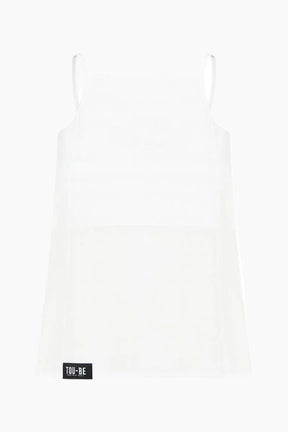 White slip dress with a brand label on a white background