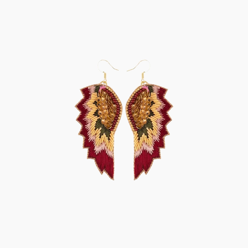 Pair of earrings with red and gold feather-like design 