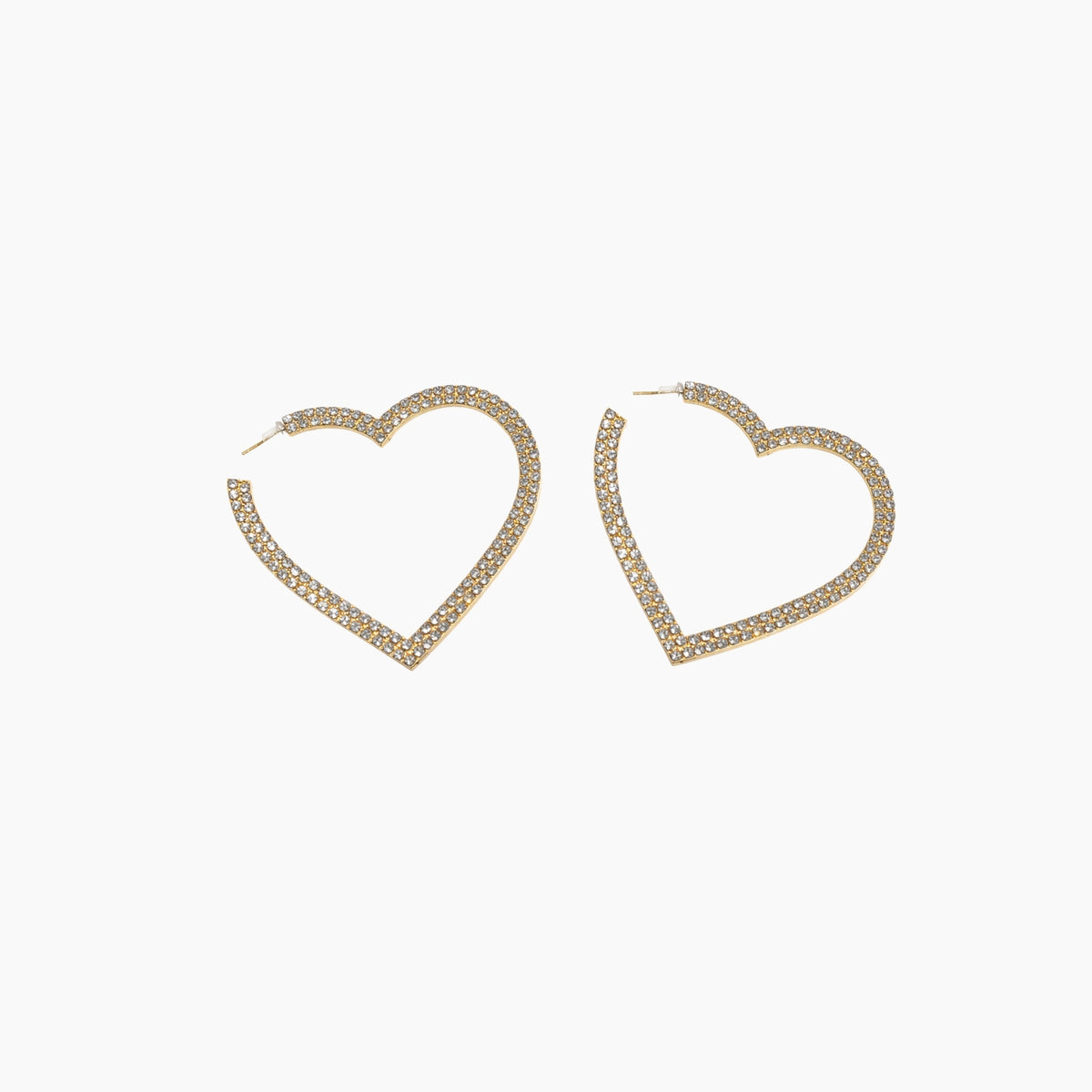Heart-shaped gold earrings on a white background