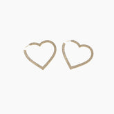 Heart-shaped gold earrings on a white background