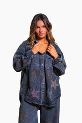 Woman wearing an oversized shirt jacket made from a soft denim effect canvas. with Glittering stars in rhinestones.