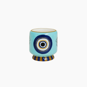 Ceramic cup with decorative design on a white background