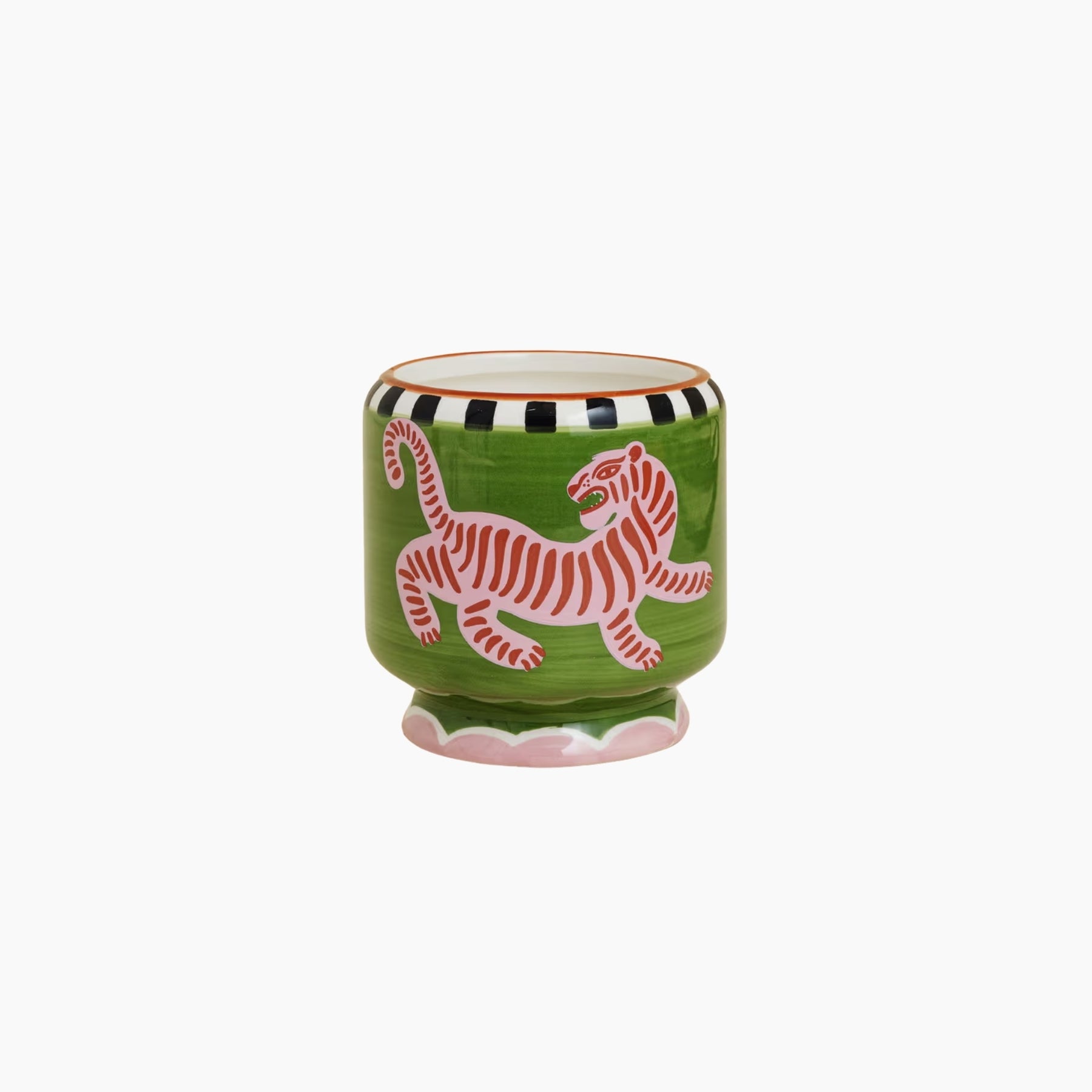 Green ceramic cup with a pink tiger design on a white background