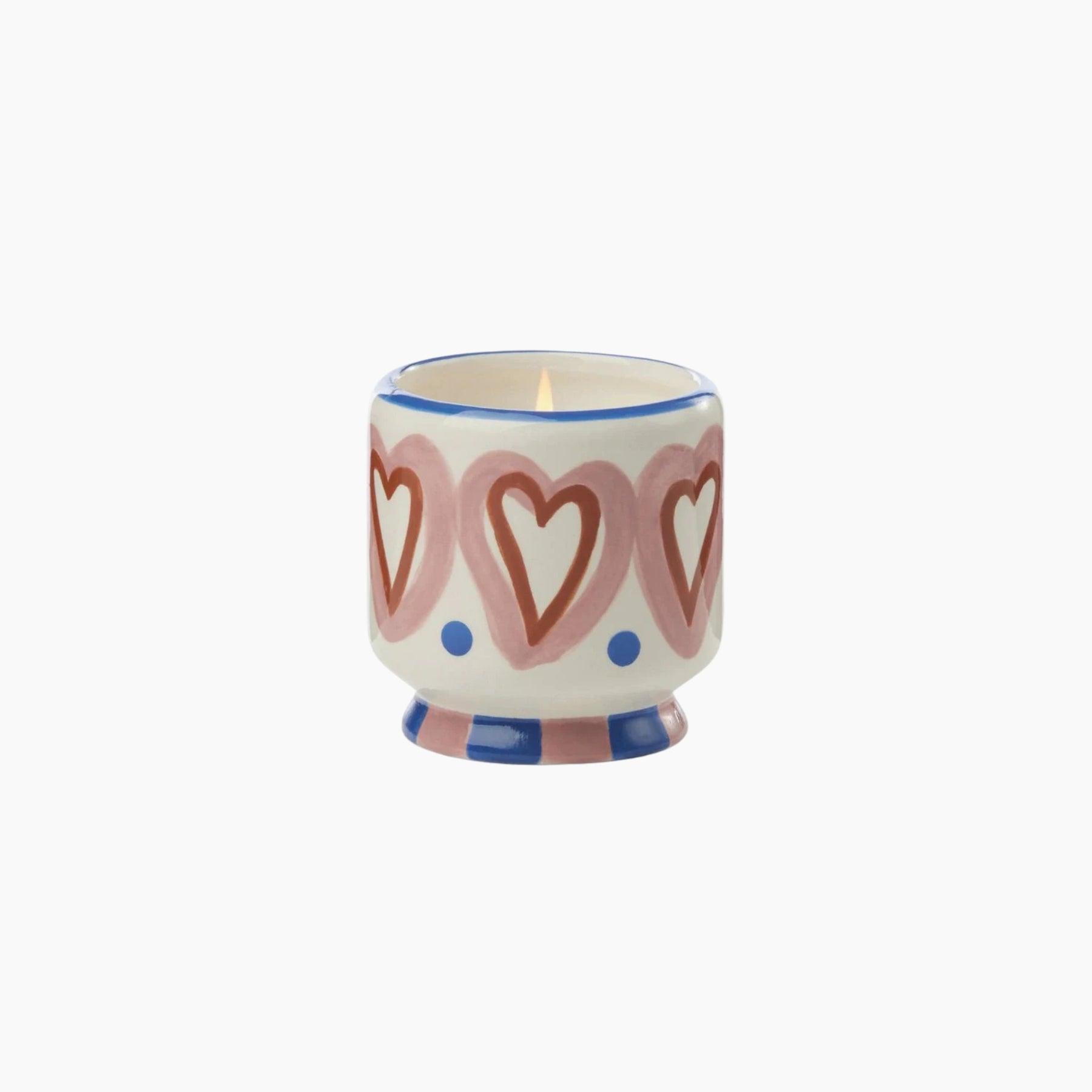Ceramic candle holder with heart design on a white background