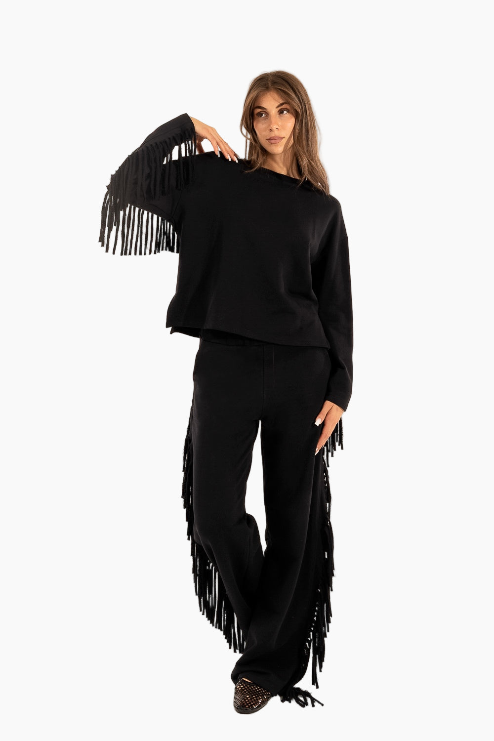 Woman wearing a black fringe outfit 