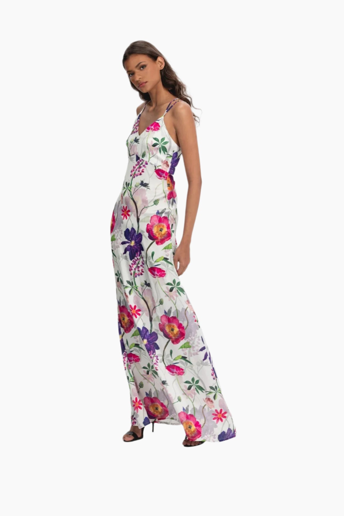 Woman wearing a  long floral dress, pink and purple