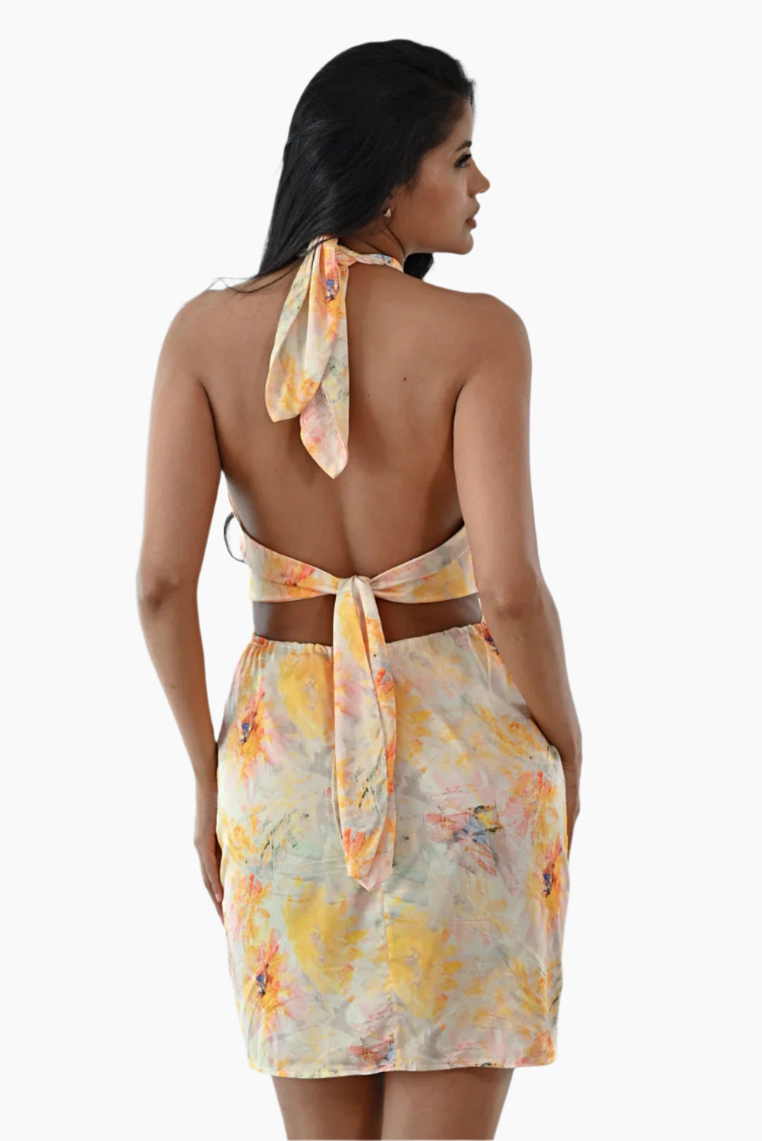 Woman wearing a floral dress with a tie knot 