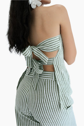Green and white striped dress with cut-out design.