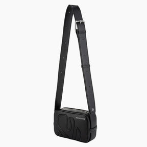 Black crossbody bag with a visible brand logo on a white background