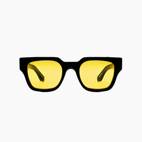 Black-framed sunglasses with yellow lenses on a white background