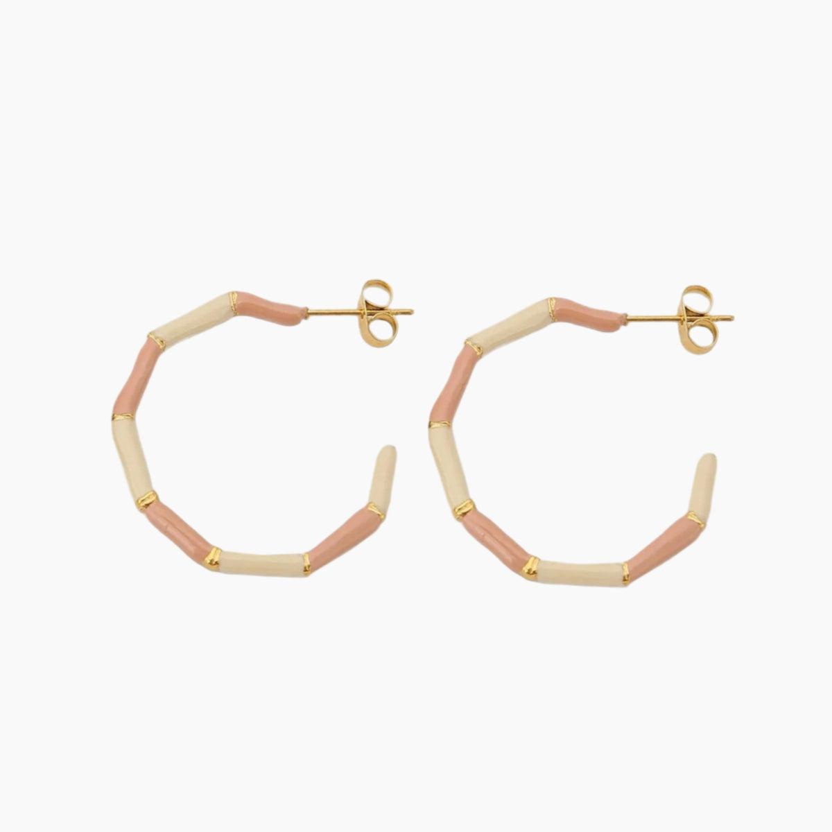 Hexagonal hoop earrings with pink and gold accents on a white background