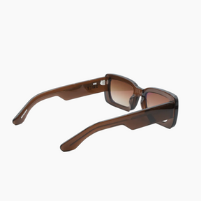 Brown sunglasses with gradient lenses on a white background