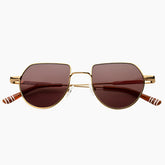 Sunglasses with gold frame and brown lenses