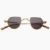 Gold-framed sunglasses with dark lenses 