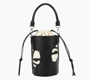 Black bucket bag with white paw print design on a white background