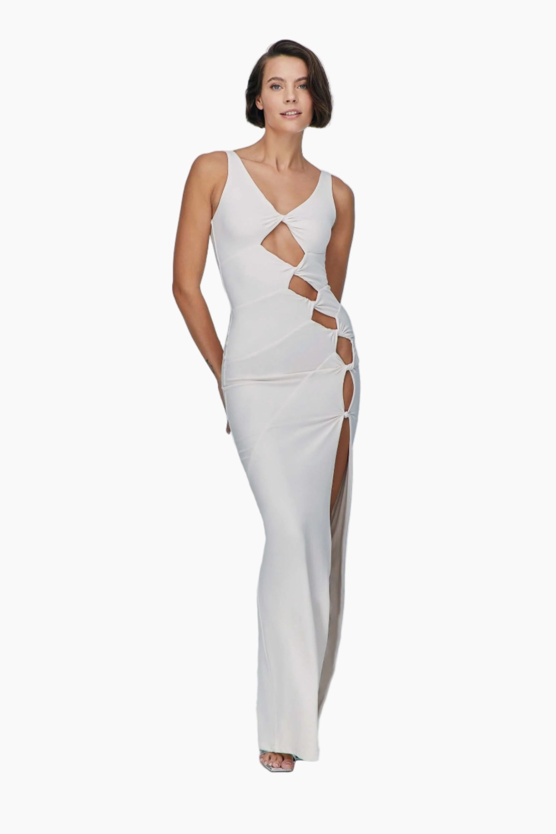 Woman wearing a white evening gown with cut-out design 