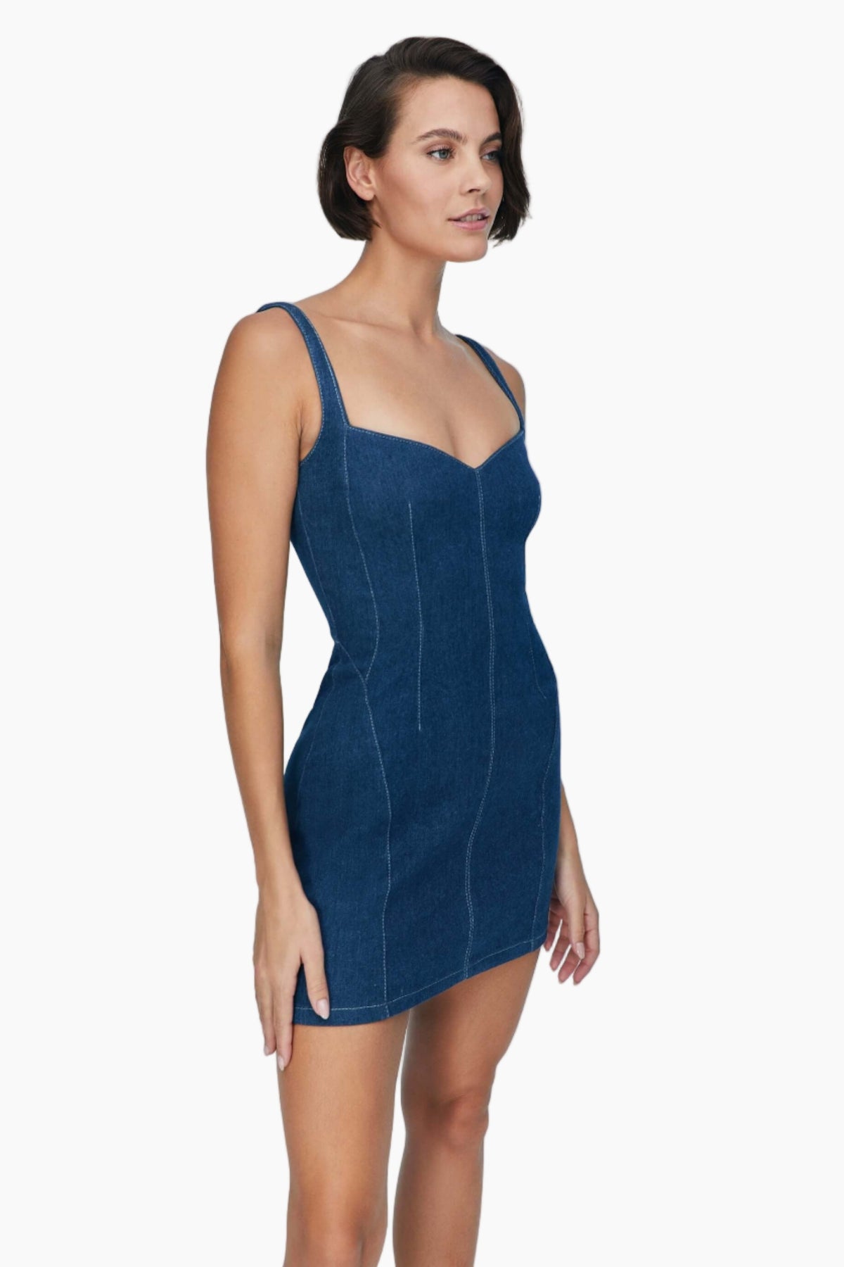 Woman wearing a blue denim short dress 