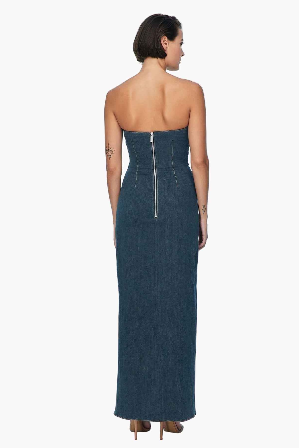 Woman wearing a strapless blue dress with a zipper detail 