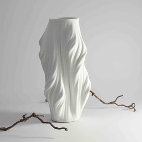  vase features a sculptural, organic design with fluid, wave-like folds 