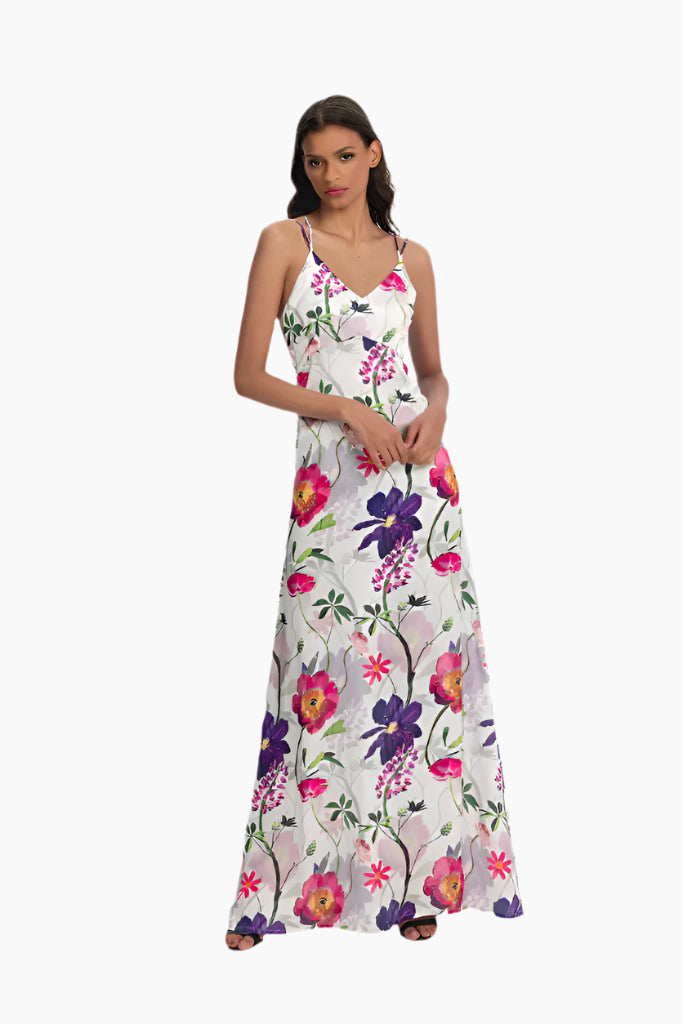 Woman wearing a  long floral dress, pink and purple