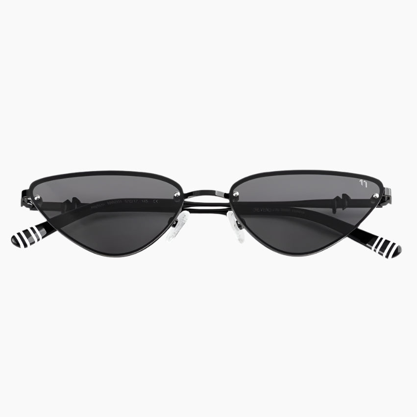 Cat-eye sunglasses with black lenses and striped arms on a white background