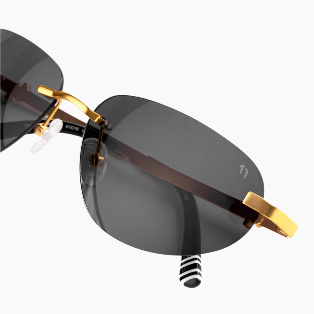 Sunglasses with gold frame and dark lenses 