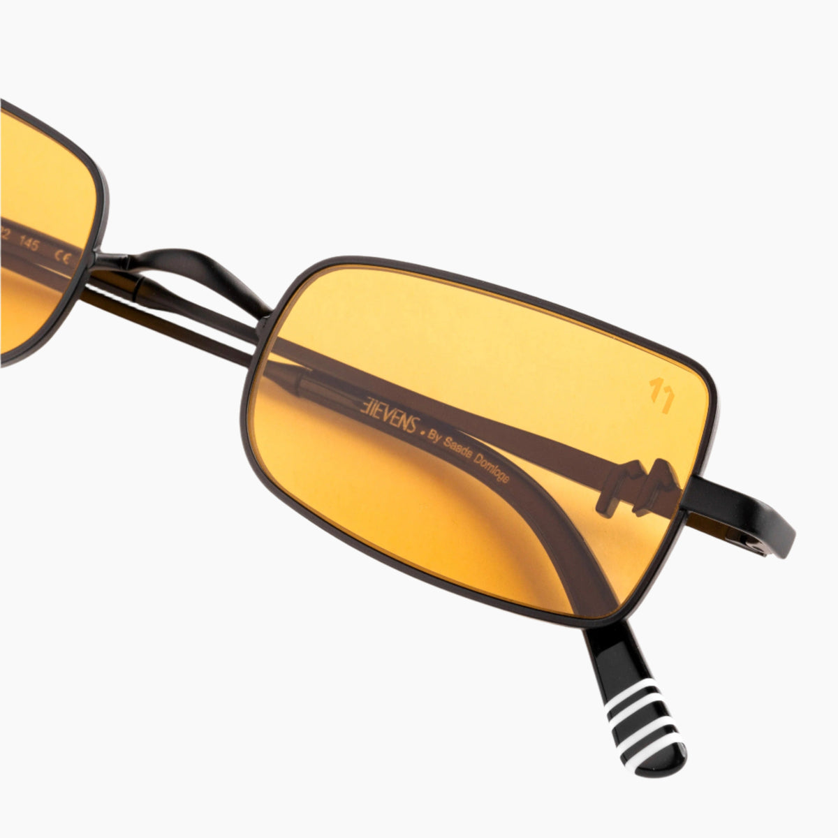 Sunglasses with gold lenses and black frames 