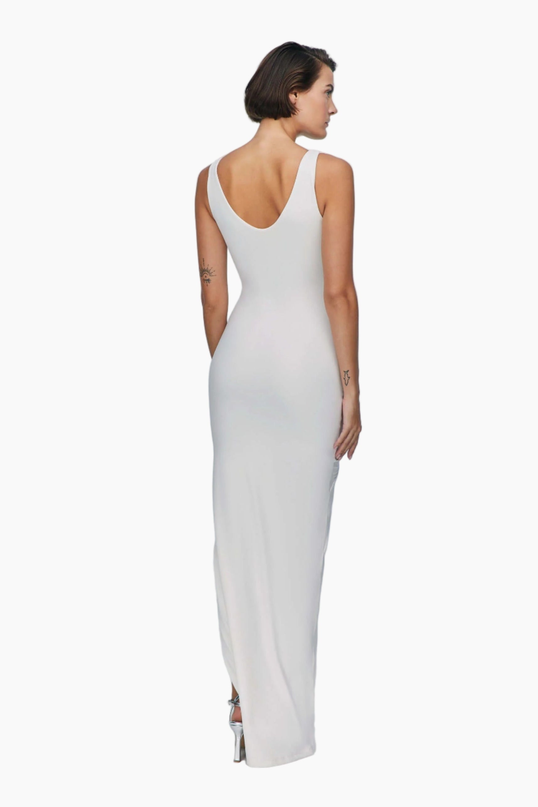 Woman wearing a white sleeveless dress 