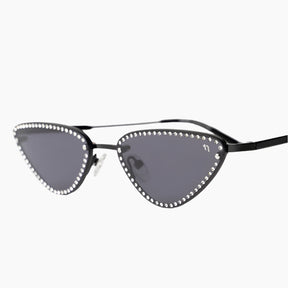 Cat-eye sunglasses with decorative frame on a white background