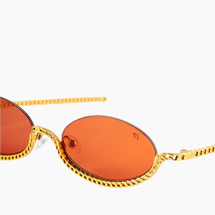 Sunglasses with orange lenses and gold chain 