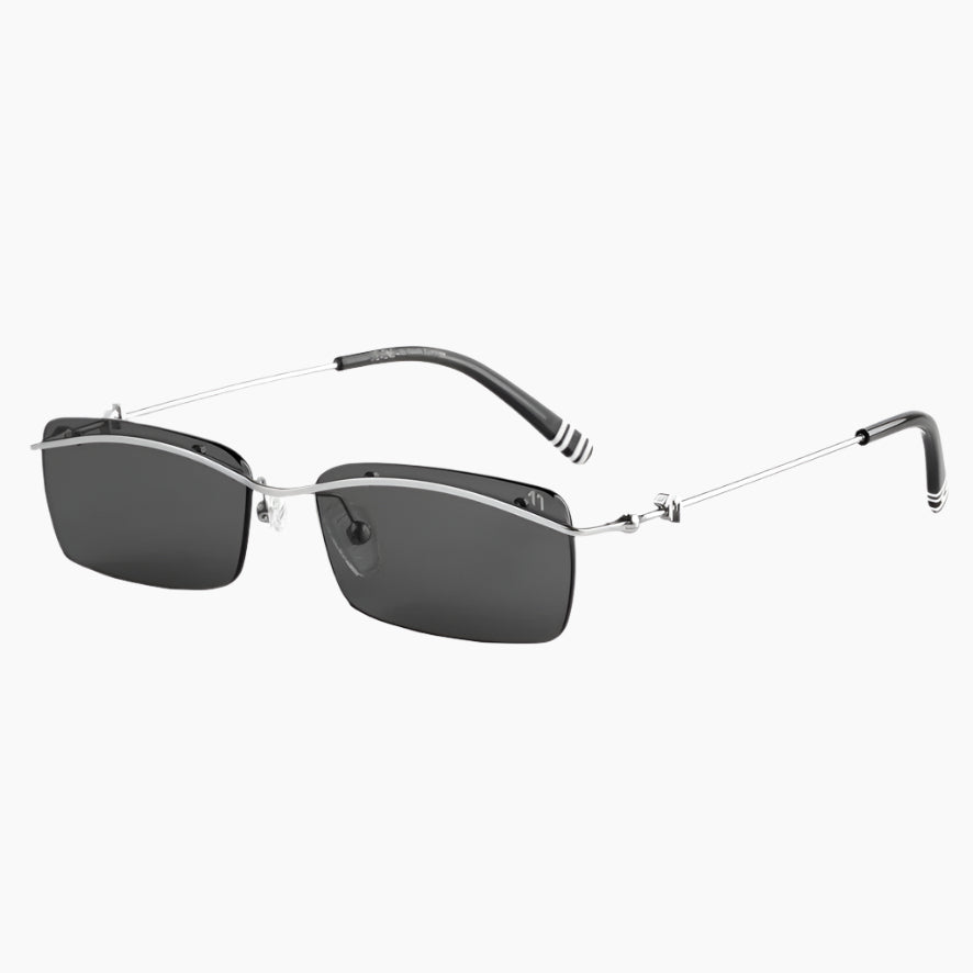 Sunglasses with thin metal frame and dark lenses on a white background
