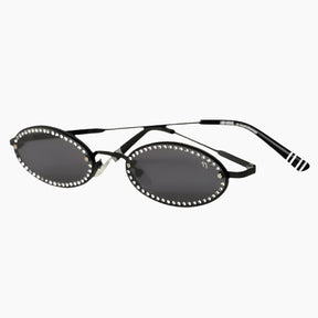 Black oval sunglasses with rhinestone embellishments on a white background