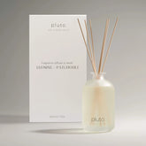 Pluto diffuser bottle with wooden sticks and packaging on a gray background