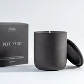 Black candle with lid and 'pluto' branded box 