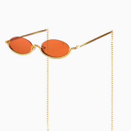 Sunglasses with orange lenses and gold chain 