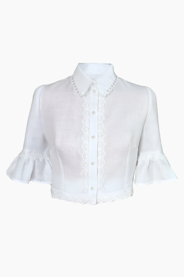  linen blouse it features pearl button fastenings and delicate lace details along the collar, sleeves, and front 