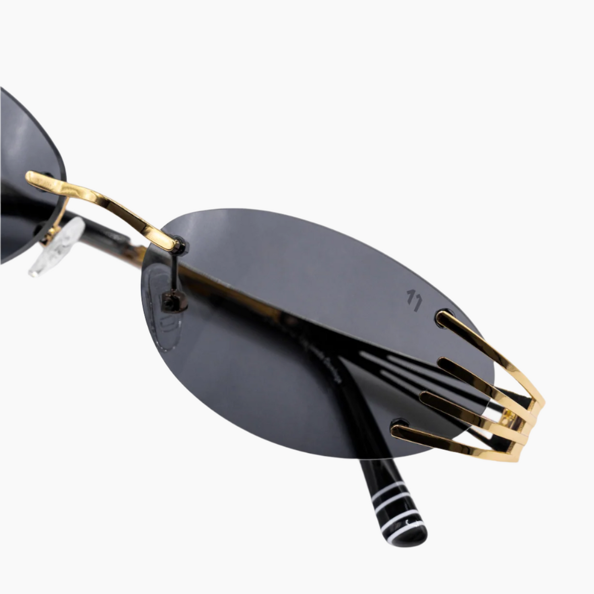 Sunglasses with gold frames and black lenses 