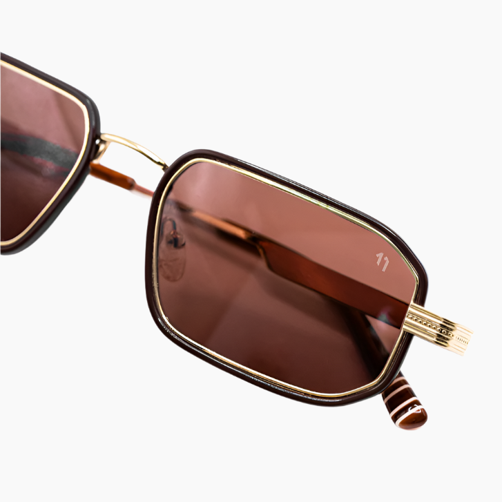 Sunglasses with gold frame and brown lenses 