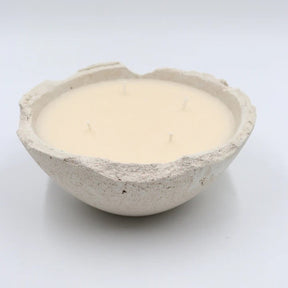 Ceramic bowl with a smooth, light-colored interior on a white background