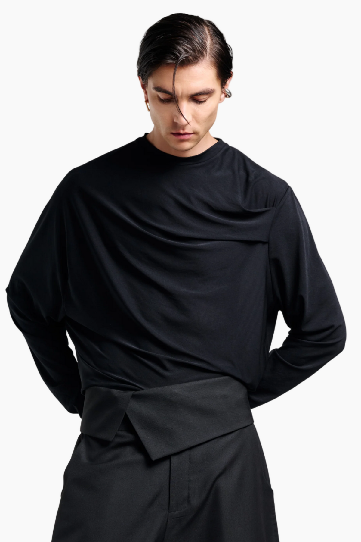 Person wearing a black outfit black top and pants 